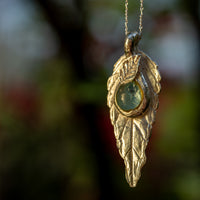 Leaf pendant with small diachronic glass cabochon